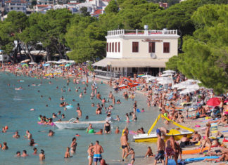 4 Locations Affected By Mass Tourism That Vacationers Want To Know Crowded Beach In Makarska Croatia Overtourism Concept