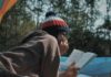 10 Books That Will Encourage You To E-book A Flight Girl reading a book while camping in a tent