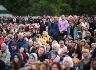 From metropolis centre screens to airports, Britons watch historic funeral for queen SEI126056559