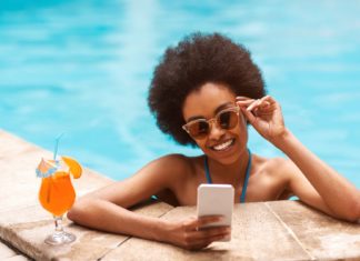 Finest all-inclusive holidays to sunny locations from £42pp an evening in October beautiful black girl tropical cocktail 713637593