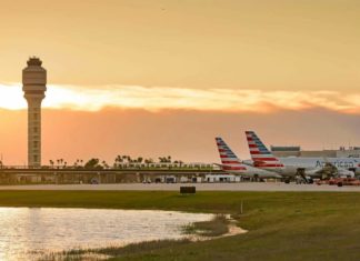 A number of Florida Airports to Stop Operations In Preparation for Hurricane Ian orlando international airport planes on tarmac at sunset