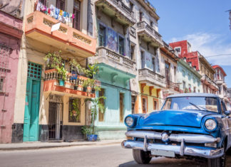 How one can Keep Protected Whereas Driving on Trip: 7 Necessary Steps to Take stay safe while driving a car car parked on colorful road 1000x600