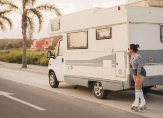 6 Issues You Didn’t Know About Caravan Upkeep female skater standing caravan road peeking