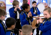 College fife and drum corps greets veterans with patriotic music at Dulles Airport