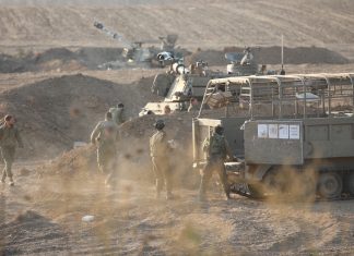 Israel strikes airports in Syria and retrieves some hostages’ bodies as it prepares to invade Gaza