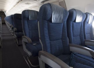 On an airplane, which passenger gets the armrests?